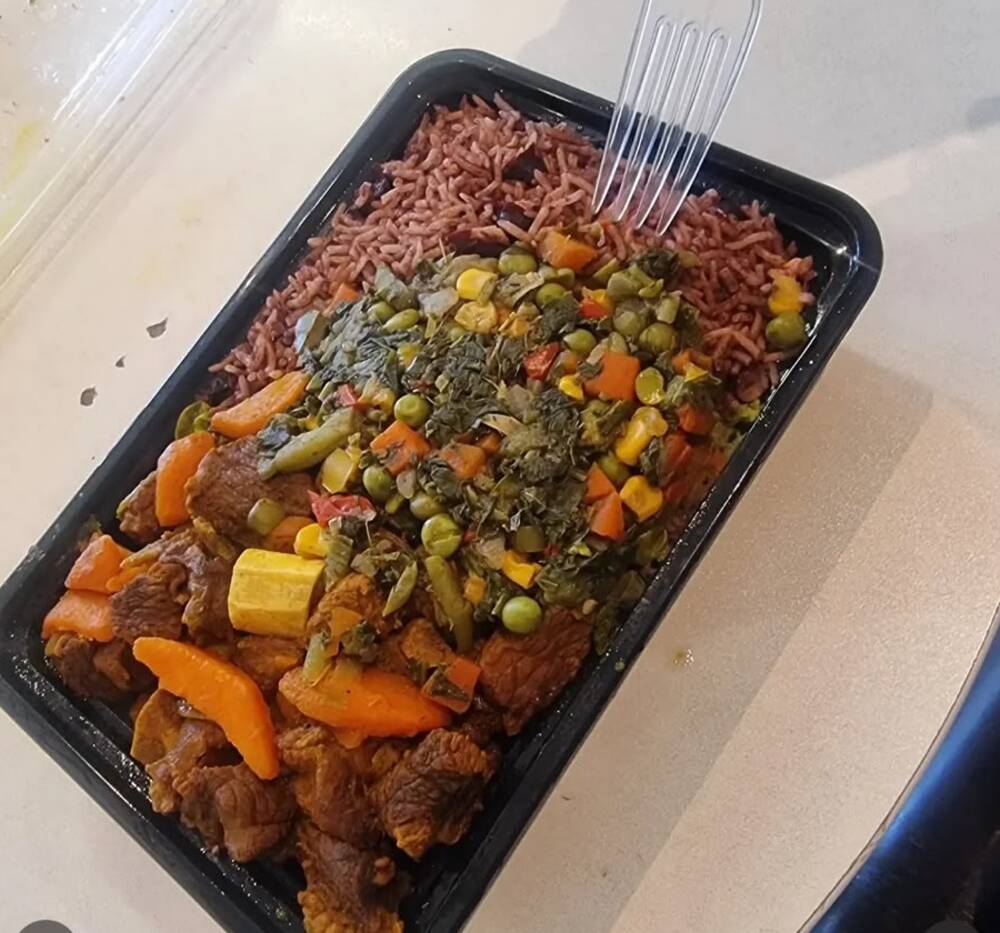 Brown stew with rice and peas and vegetables